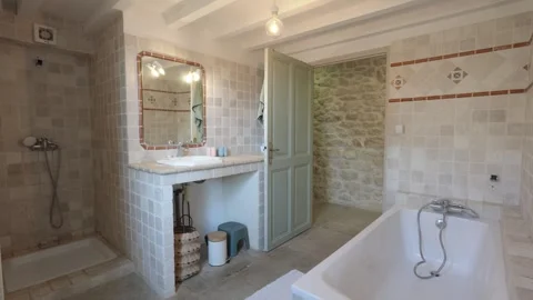 Slow motion Tilt down Shot of Rustic French Farmhouse Bathroom, Warm Interior Stock Footage 337533866