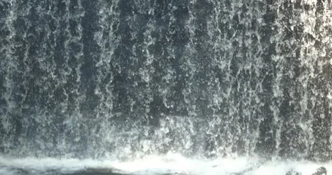 Slow motion tilt down of waterfall 動画素材 247142652