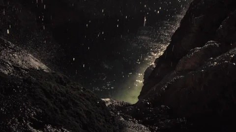 Slow motion tilt shot of interior of tropical cave with water drops falling. Stock Footage 114310386