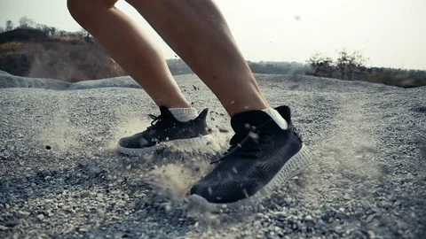 SLOW MOTION TIME WARP, Close up Trail Running in the rock mountain slide brake Stock Footage 124351880