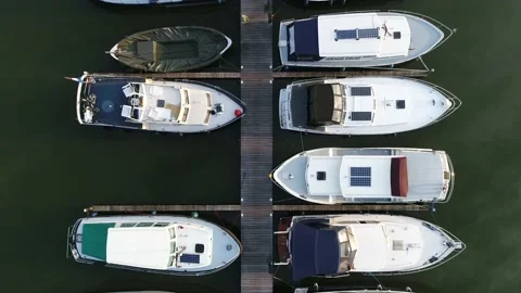 Slow motion top down aerial view of marina with small recreational boats 4k Stock Footage 144007074