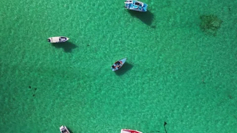 Slow motion top down aerial view of fishing boat in vast open ocean Stock Footage 273167265