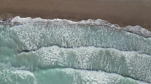 Slow Motion Top-Down Aerial View of Rhythmic Sea Foam and Waves Video stock 327762066