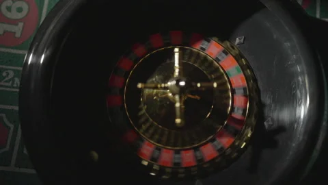 Slow motion top-down ball rolling in roulette Stock Footage 335699840