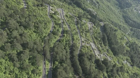 Slow Motion Top-Down Drone Shot of Serpentine Road Above Kotor, Montenegro Stock Footage 310335410