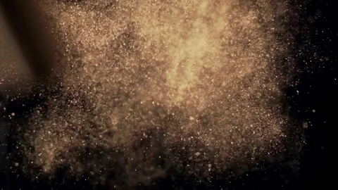 Slow motion top-down shot of cinnamon sticks with spice powder exploding toward Video stock 308370199
