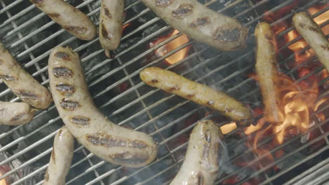 Slow motion top view camera pans over grilled sausages Stock Footage 145831939