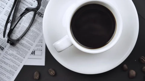 Slow motion top view of coffee pour into cup from turk coffee make on the table  Stock Footage 127598967
