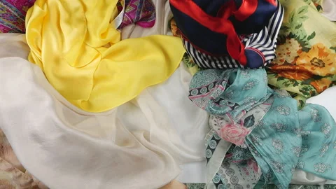 Slow motion top view of colorful silk fabrics. Stock Footage 337406710