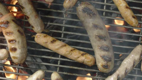 Slow motion top view grilled sausages spinning and roasting Stock-Footage 145831308