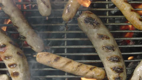 Slow motion top view grilled sausages spinning and roasting Stock Footage 145831395