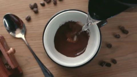 Slow motion on top view a hot water pouring into a cup from a teapot for making Stock Footage 246761103