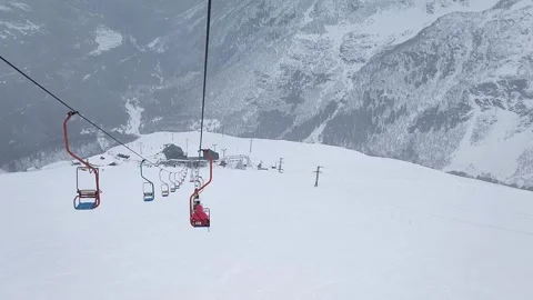 Slow motion. Top view of the ski slope of the mountain resort and the cable car Stock Footage 166092830