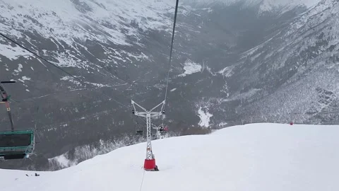 Slow motion. Top view of the ski slope of the mountain resort and the cable car Stock Footage 166160668