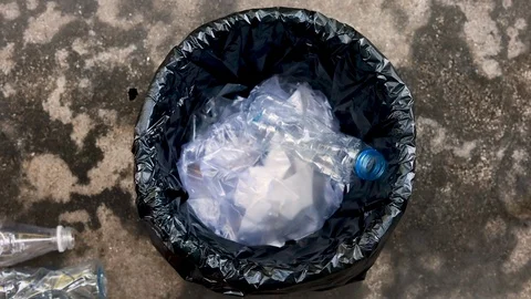 Slow motion top view Throw the plastic bottles into the trash. Stock Footage