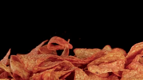 Slow Motion Tortilla Chips Dropping Onto Pile Against Black Background Stock Footage 321263410
