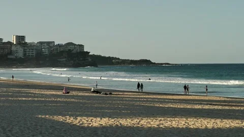 Slow motion tourists at Manly beach and Queenscliff properties in distance Stock Footage 292374419