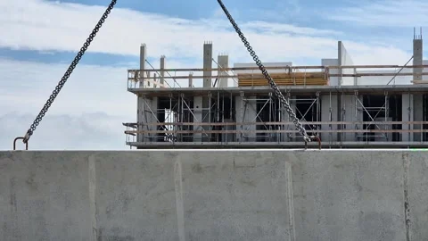 Slow Motion Tower Crane Lifting Concrete Wall Panel Stock Footage 338400606