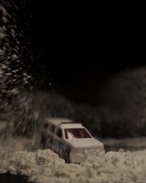 Slow motion toy car falling in darkness Stock Footage 300125644