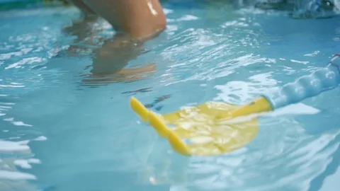 Slow motion toy floating on clean water of baby swimming pool Stock Footage 91218198