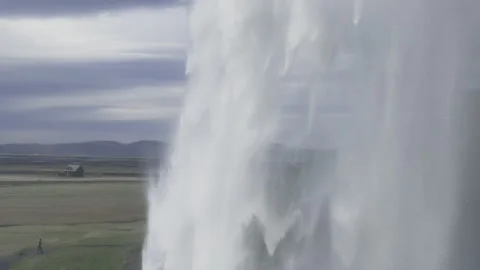 Slow motion tracking behind Waterfall Iceland glacial water rushing 4k hdr Stock Footage 279349753