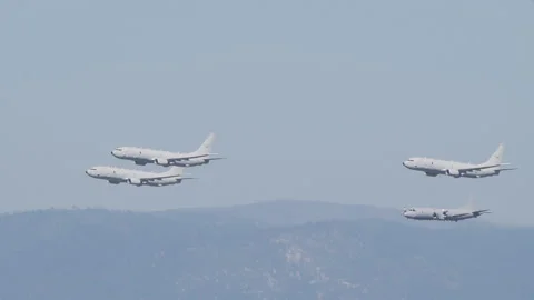 Slow motion tracking clip of RAAF Poseidon and Orion aircraft Stock Footage 153956365