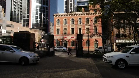 Slow motion tracking George street pedestrians and traffic in Sydney 4K Stock Footage 202628557