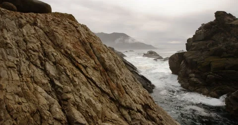 Slow Motion Tracking Next To Ocean With Mountain Bikers Carrying Bikes Stock Footage 64313866