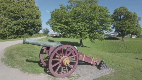 Slow motion tracking past a cannon on the Kastellet rampart Stock Footage 341288907