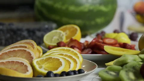 Slow motion tracking shot across delicious looking fruit on kitchen counter Stock Footage 341191886