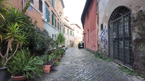 Slow Motion Tracking Shot Of Ancient Cobblestone Alleys In Trastevere Rome Video stock 328846035