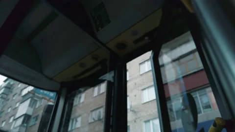 Slow motion tracking shot of closing pneumatic door in a bus. Detail of a bus Stock Footage 141983484