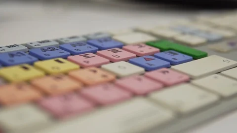 Slow Motion: Tracking Shot of an Editors Keyboard with Colorful Keys, Stock Footage 124658308