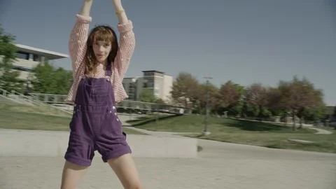 Slow motion tracking shot of girl falling while roller skating / Salt Lake City, Stock Footage 136242853