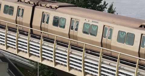 Slow motion tracking shot of metro train moving from Golden Horn Metro Bridge Stock Footage 318672333