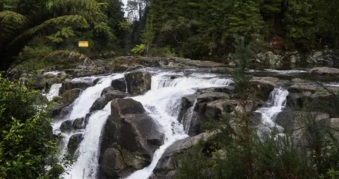 Slow motion tracking shot of rushing waterfall Stock Footage 90102590