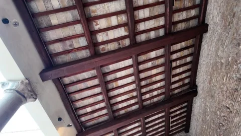 Slow Motion Tracking Shot Of Rustic Timber Roof In Church Courtyard Vídeos de archivo 330122816