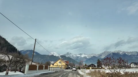 Slow Motion Tracking Shot Of A Snowy Mountain Road In Austrian Alps Stock Footage 328695048
