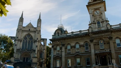 Slow motion tracking shot two Victorian styled buildings, Dunedin New Zealand Stock Footage 88382187