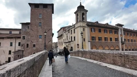 Slow Motion Tracking Shot Walking Through Isola Tiberina In Rome 動画素材 328842189