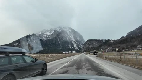 Slow Motion Tracking Shot Of Winter Mountains From Moving Car Austria 動画素材 328694886