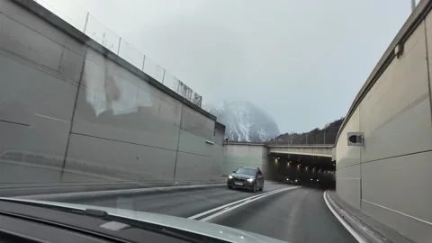 Slow Motion Tracking Shot Of A Winter Highway In The Austrian Alps Stock Footage 328694896