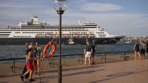 Slow motion tracking tourists waving at P and O Cruise Liner background Video stock 159575454
