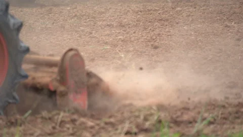 Slow motion tractor plowing and working prepare soil land for plantation in farm Stock-Footage 136055970