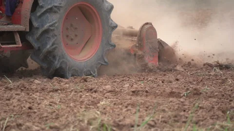 Slow motion tractor plowing and working prepare soil land for plantation in farm Stock Footage 136056448