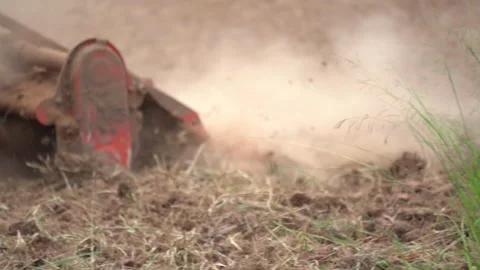 Slow motion tractor plowing and working prepare soil land for plantation in farm Stock-Footage 136056630