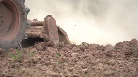 Slow motion tractor plowing and working prepare soil land for plantation in farm Stock Footage 136905822