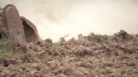 Slow motion tractor plowing and working prepare soil land for plantation in farm Video stock 136905902