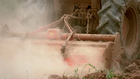 Slow motion tractor plowing and working prepare soil land for plantation in farm Stock Footage 136907426