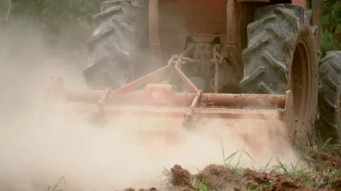 Slow motion tractor plowing and working prepare soil land for plantation in farm Vidéo 136908030